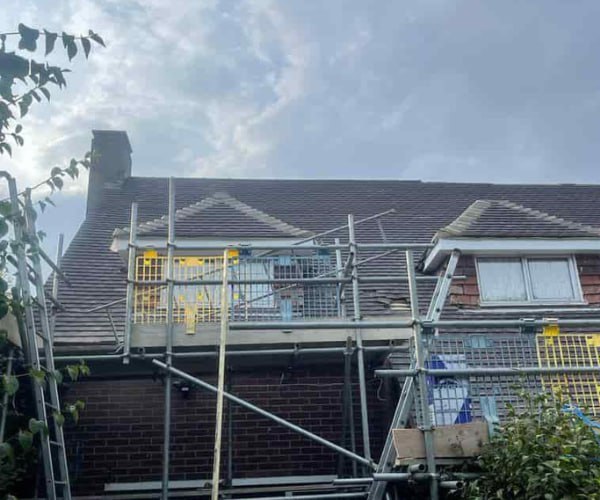 This is a photo of a roof with two dormers that is having some damaged tiles replaced. Works carried out by DGH Roofing Armthorpe