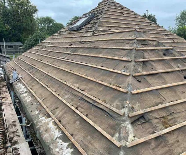 This is a photo of a hip roof that has been stripped back to the battens, and is awaiting a new roof covering to be installed. Works carried out by DGH Roofing Armthorpe